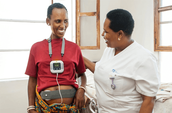 Two people using equipment