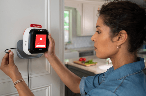 Medical personnel using AED