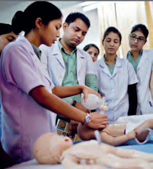 A group of doctors preforming nurse training in India